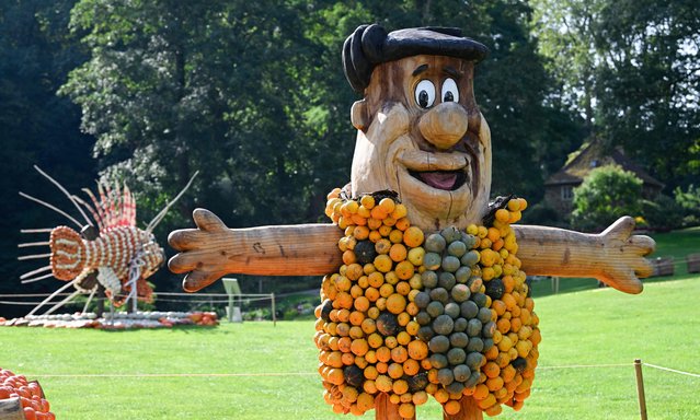 A character depicting Fred Flintstone is seen at a pumpkin exhibition in the garden of Ludwigsburg Castle in Ludwigsburg, southern Germany, on August 24, 2023. (Photo by Thomas Kienzle/AFP Photo)