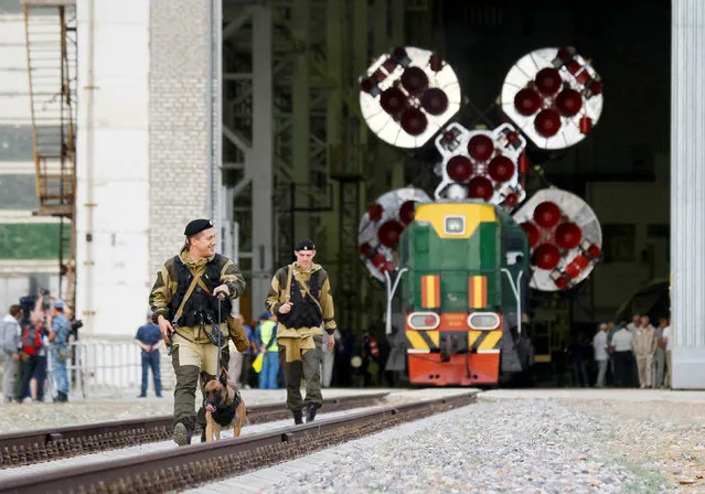 Police officers with a sniffer dog check a railway as the Soyuz MS spacecraft for the next International Space Station (ISS) crew of Kate Rubins of the U.S., Anatoly Ivanishin of Russia and Takuya Onishi of Japan is ready to be transported from an assembling hangar to the launchpad ahead of its launch scheduled on July 7, at the Baikonur cosmodrome in Kazakhstan July 4, 2016. (Photo by Shamil Zhumatov/Reuters)