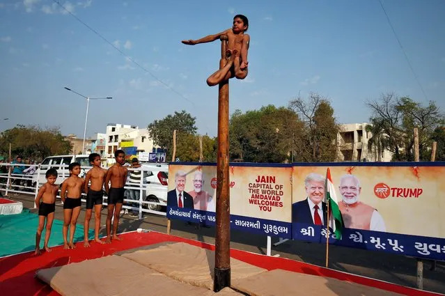 Participants practice “Malkhamb” (traditional Indian gymnastics) during a rehearsal for the “Namaste Trump” event ahead of the visit of U.S. President Donald Trump, in Ahmedabad, February 23, 2020. (Photo by Amit Dave/Reuters)