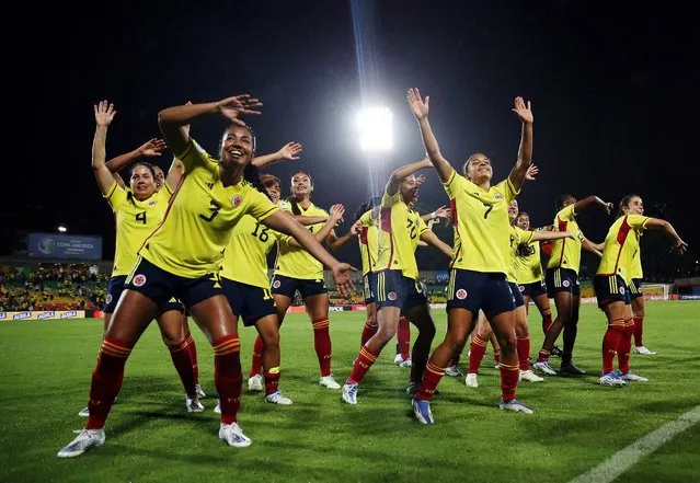 Colombia players celebrate at the end of the Conmebol 2022 women's Copa America football tournament semifinal match between Colombia and Argentina at the Alfonso Lopez stadium in Bucaramanga, Colombia, on July 25, 2022. (Photo by Luisa Gonzalez/Reuters)