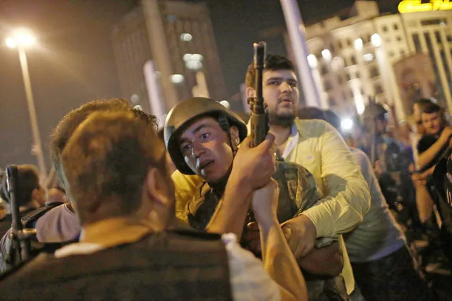 Turkish police arrest Turkish soldiers at the Taksim Square in Istanbul, Turkey, 16 July 2016. Turkish Prime Minister Yildirim reportedly said that the Turkish military was involved in an attempted coup d'etat. The Turkish military meanwhile stated it had taken over control. (Photo by Sedat Suna/EPA)