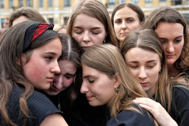 Women react during a rally of relatives and friends of defenders of the Azovstal Iron and Steel Works in Mariupol, demanding to recognise Russia as a state sponsor of terrorism after killing Ukrainian prisoners of war (POWs) in a prison in Olenivka, outside of Donetsk, as Russia's attack on Ukraine continues, in Kyiv, Ukraine on August 4, 2022. (Photo by Valentyn Ogirenko/Reuters)