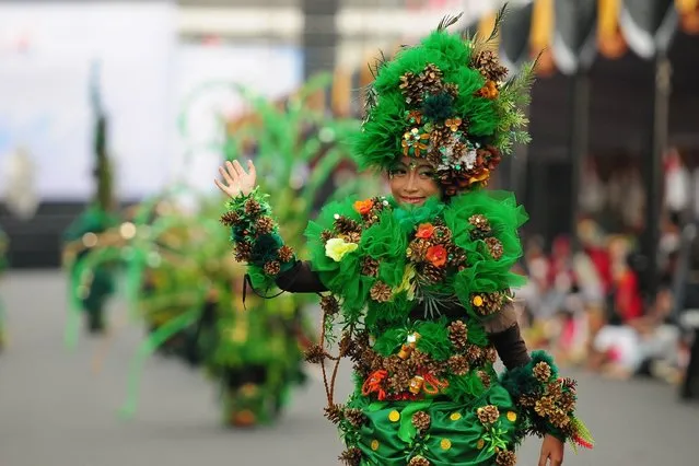 A model wears a Pine Forest costume in the kids carnival during The 13th Jember Fashion Carnival 2014 on August 21, 2014 in Jember, Indonesia. (Photo by Robertus Pudyanto/Getty Images)
