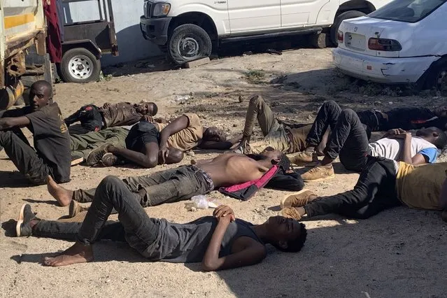 Some of the 14 illegal immigrants who survived rest after they were found in a container transported on a truck in Tete province, in the western part of Mozambique, Mussacama, 24 March 2020. According to sources, 64 were found dead and 14 survived and the deaths are said to have been due to asphyxiation and the victims are said to be illegal immigrants from different countries who crossed the border from Malawi to Mozambique. (Photo by EPA/EFE/Stringer)