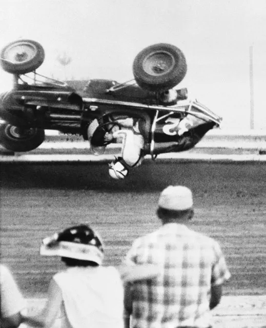 Jack Rounds, 23, Los Angeles, Calif., escaped serious injury when his sprint car crashed into the outside rail and rolled over in mid-air during the 2nd lap of the semi-feature event at the Terra Haute speedway on August 22, 1960. Rounds was taken to a local hospital and detained for observation. Cecil Beaver won the semi-feature race. (Photo by AP Photo)