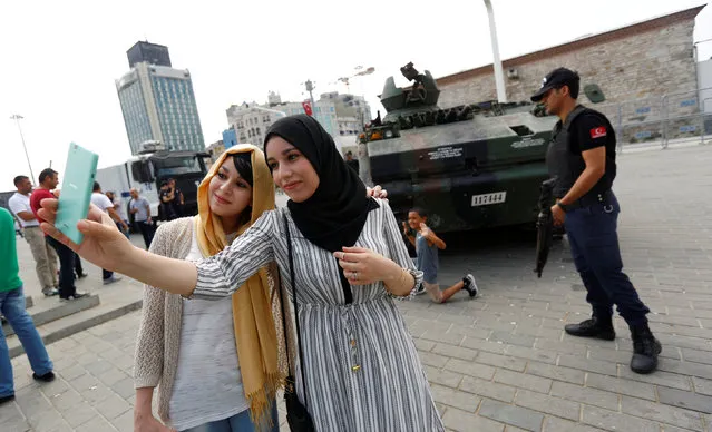 Algerian tourists take a selfie in front of an abandoned tank, following a thwarted coup, at Taksim Square in Istanbul, Turkey, July 17, 2016. (Photo by Murad Sezer/Reuters)