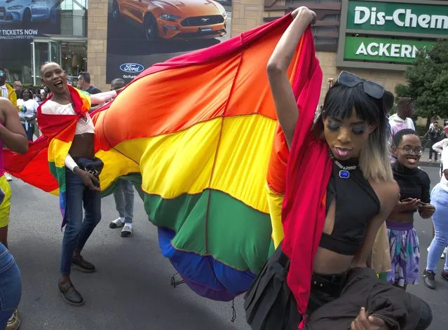 Members of the LGTBQ community take part in a Pride march in Sandton, Johannesburg, Saturday, October 29, 2022. (Photo by Denis Farrell/AP Photo)