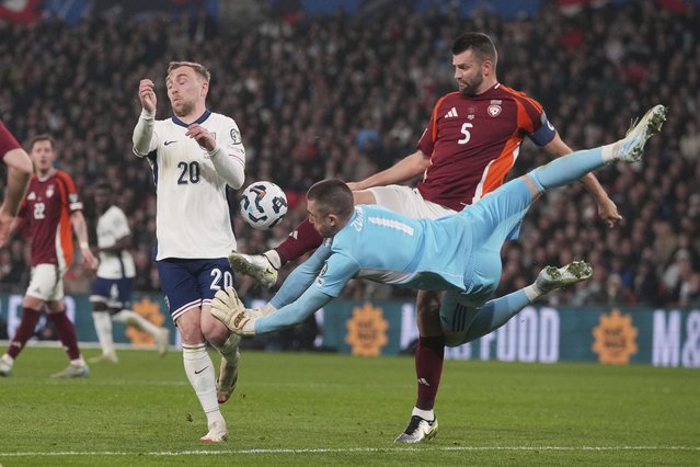 Latvia's goalkeeper Krisjanis Zviedris in action against England's Jarrod Bowen during a World Cup qualifying soccer match between England and Latvia at Wembley stadium in London, Monday, March 24, 2025. (Photo by Kin Cheung/AP Photo)