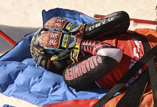 Overall World Cup skiing champion Italy's Federica Brignone is carried away on a toboga after she broke multiple bones in her left leg during a giant slalom crash at the Italian championships in the Lusia ski area, in Val di Fassa, Italy, Thursday, April 3, 2025. (Photo by Elvis Piazzi/AP Photo)