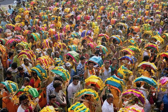 Tamil Hindu devotees participate in a religious procession called Kavad Yatra during Panguni Uthiram festival in Ahmedabad, India, Friday, April 11, 2025. (Photo by Ajit Solanki/AP Photo)
