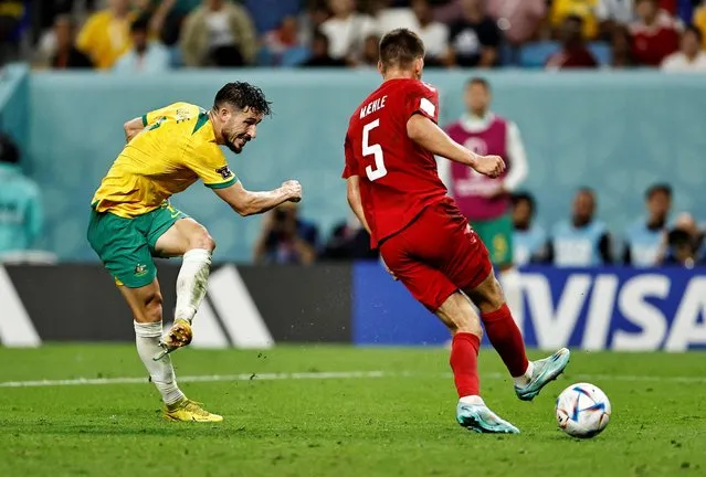 Australia's Mathew Leckie (L) scores a second-half goal in a World Cup Group D football match against Denmark at Al Janoub Stadium in Al Wakrah, Qatar on November 30, 2022. (Photo by Hamad I Mohammed/Reuters)