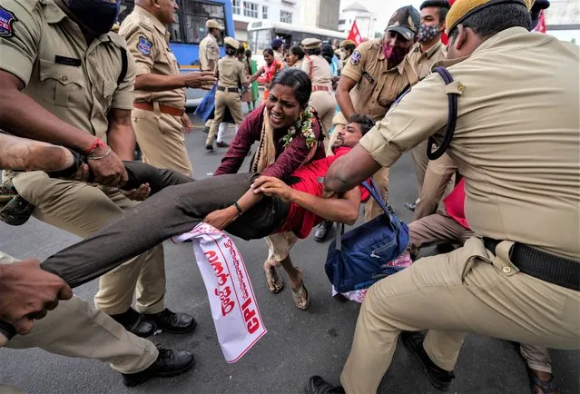 Police detain activists of Communist Party of India, who marched to the Telangana state Governor's official residence demanding abolition of Governor system in states in Hyderabad, India, Wednesday, December 7, 2022. (Photo by Mahesh Kumar A./AP Photo)