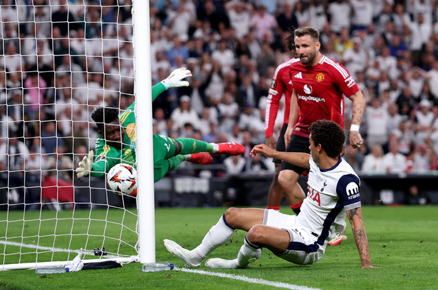 Brennan Johnson of Tottenham Hotspur scores his team's first goal past Andre Onana of Manchester United as Luke Shaw of Manchester United looks on during the UEFA Europa League Final 2025 between Tottenham Hotspur and Manchester United at Estadio de San Mames on May 21, 2025 in Bilbao, Spain. (Photo by Michael Steele/Getty Images)