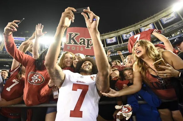 San Francisco 49ers quarterback Colin Kaepernick greets fans after their 31-21 win against the San Diego Chargers during an NFL preseason football game Thursday, September 1, 2016, in San Diego. (Photo by Denis Poroy/AP Photo)