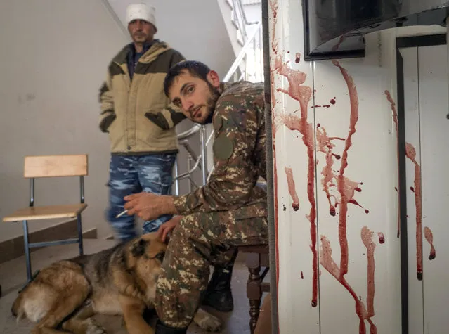 A bloody door is seen in a hospital damaged by shelling from Azerbaijan's artillery in the town of Martakert, the separatist region of Nagorno-Karabakh, Thursday, October 15, 2020. (Photo by AP Photo/Stringer)