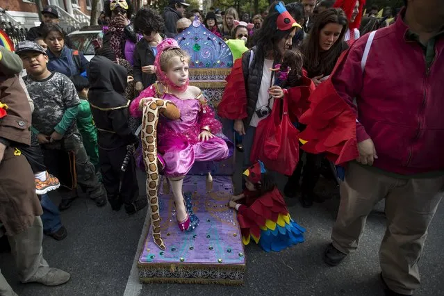 A child dressed as a genie takes part in the Children's Halloween day parade at Washington Square Park in the Manhattan borough of New York October 31, 2015. (Photo by Carlo Allegri/Reuters)