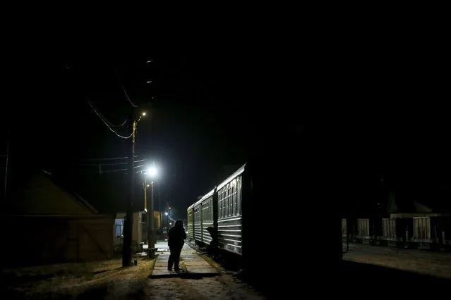 Local residents await the departure of a train to the town of Alapayevsk, in Sankin, Sverdlovsk region, Russia, October 15, 2015. (Photo by Maxim Zmeyev/Reuters)