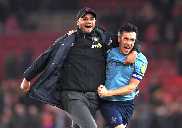 Burnley Manager Vincent Kompany (l) celebrates with Jack Cork after Burnley had sealed promotion after the Sky Bet Championship between Middlesbrough and Burnley at Riverside Stadium on April 07, 2023 in Middlesbrough, England. (Photo by Stu Forster/Getty Images)