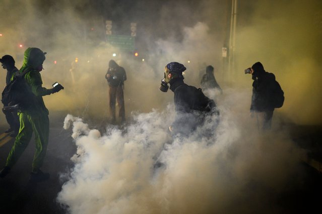 Anti-I.C.E. protesters clash with federal agents at the U.S. Immigration and Customs Enforcement building on October 18, 2025 in Portland, Oregon. Organizers expect millions to participate in cities and towns across the nation for the second “No Kings” protest to denounce the Trump administration. (Photo by Mathieu Lewis-Rolland/Getty Images)