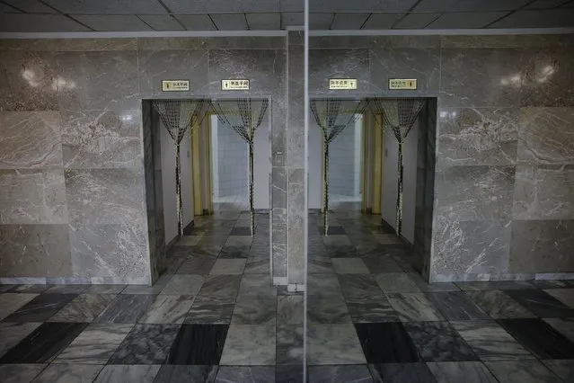 The entrance to toilets is reflected in a mirror in the lobby of Yanggakdo International Hotel in Pyongyang, North Korea, October 11, 2015. Foreign tourists to Pyongyang usually stay at the hotel. (Photo by Damir Sagolj/Reuters)