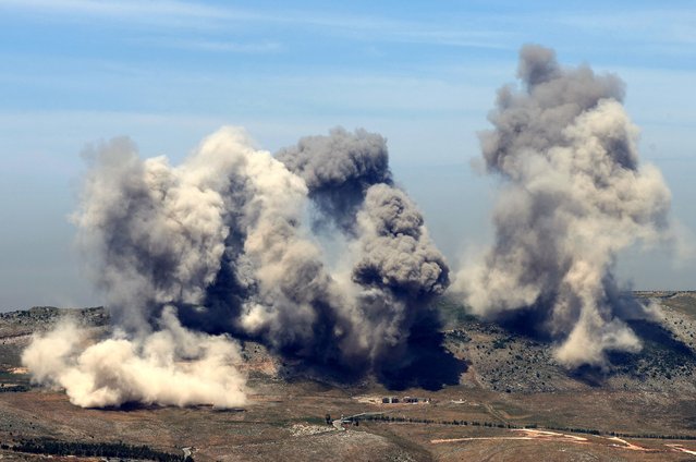 This pictures taken from the southern Lebanese area of Marjeyoun shows smoke billowing from the site of Israeli airstrikes on the hills of the southern Lebanese village of Nabatiyeh on May 8, 2025. (Photo by Rabih Daher/AFP Photo)