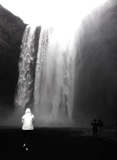 “Skogafoss Waterfall”. The Skogafoss is named after the river crashing down the cliffs. Skogar is Icelandic for “wood” and it is therefore assumed there were once trees in that area. I took this shot as my tourmates admired the majestic beauty of the waterfall while all of us tried to brave the intense cold. (Photo and caption by Cher Gonzalez/National Geographic Traveler Photo Contest)