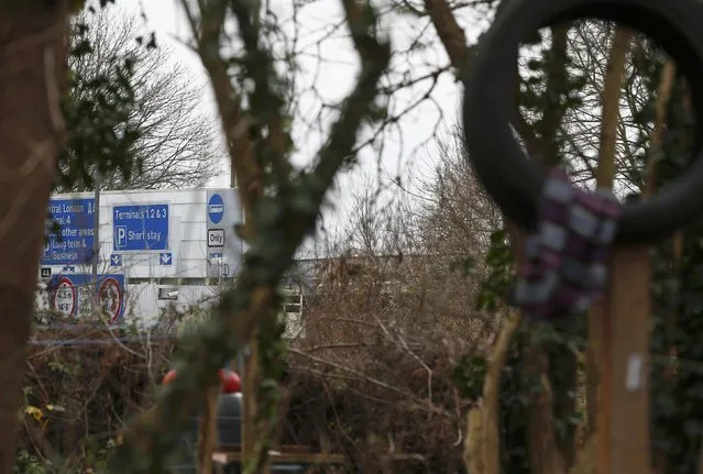 Road signs close on the approach road to Heathrow airport can be seen from the anti-Heathrow expansion activists', 'Grow Heathrow' protest camp, in the village of Sipson near to Heathrow Airport, west London Britain December 7, 2015. (Photo by Peter Nicholls/Reuters)