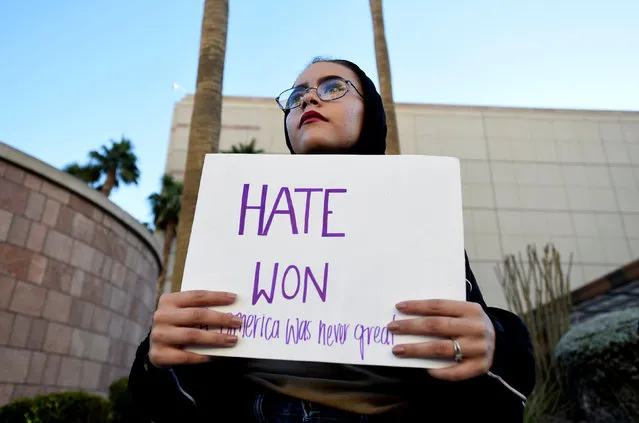 Krystina Robinson of Las Vegas carries a placard in protest against the election of Republican Donald Trump as President of the United States, across from the Trump International Hotel & Tower in Las Vegas, Nevada, U.S. November 9, 2016. (Photo by David Becker/Reuters)