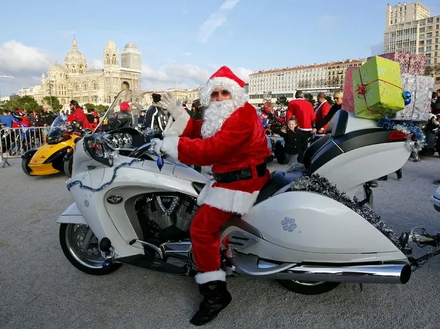 A biker dressed as Santa Claus takes part in a charity ride to bring gifts to hospitalized children in Marseille, France, December 20, 2015. (Photo by Jean-Paul Pelissier/Reuters)