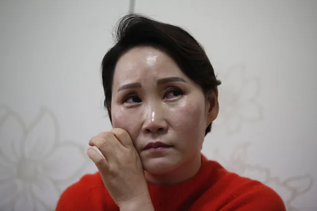North Korean defector Choi Bok-hwa wipes her tears from her cheek during an interview in Ansan, South Korea, Wednesday, February 17, 2021. For the first time in years, Choi didn’t get her annual birthday call from her mother in North Korea. Choi believes the silence is linked to the pandemic, which led North Korea to shut its borders tighter than ever and impose some of the world’s toughest restrictions on movement. (Photo by Lee Jin-man/AP Photo)