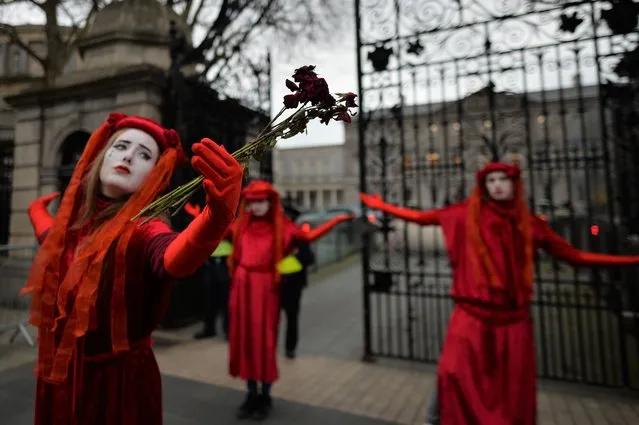 A group of anti-fracking campaigners and activists protesting outside Leinster House in Dublin, during Level 5 Covid-19 lockdown on Tuesday, March 23, 2021, in Dublin, Ireland. (Photo by Artur Widak/NurPhoto/Rex Features/Shutterstock)