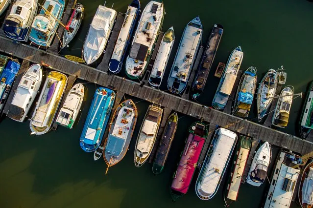 Boats moored on Bristol Harbourside on a calm and mild morning in the South West on Tuesday March 9, 2021, where a Met Office weather warning for high winds across parts of the UK is in force until Thursday 11th March. (Photo by Ben Birchall/PA Images via Getty Images)