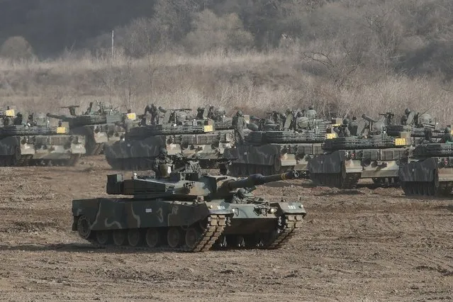 A South Korean army's K1A2 tank moves during a military exercise in Paju, South Korea, near the border with North Korea, Wednesday, March 17, 2021. In North Korea's first comments directed at the Biden administration, Kim Jong Un's powerful sister Kim Yo Jong on Tuesday warned the United States to “refrain from causing a stink” if it wants to “sleep in peace” for the next four years. (Photo by Ahn Young-joon/AP Photo)