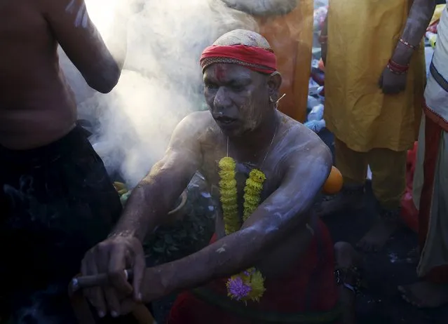 A Hindu devotee is seen in a trance before his pilgrimage to Batu Caves during Thaipusam in Kuala Lumpur, Malaysia, January 24, 2016. (Photo by Olivia Harris/Reuters)