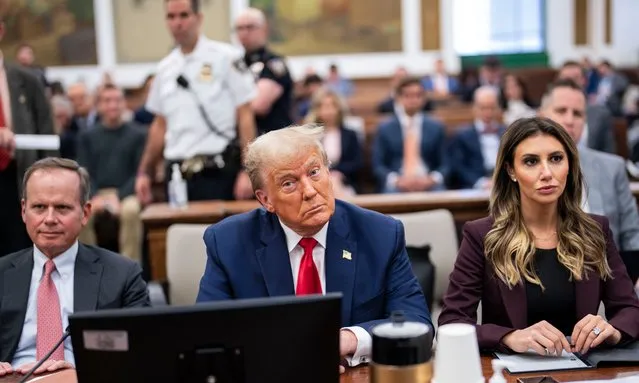 Former President Donald Trump sits in the courtroom with attorneys Christopher M. Kise and Alina Habba during his civil fraud trial at New York State Supreme Court on October 17, 2023 in New York City. Trump may be forced to sell off his properties after Justice Arthur Engoron canceled his business certificates after ruling that he committed fraud for years while building his real estate empire after being sued by Attorney General Letitia James, who is seeking $250 million in damages. The trial will determine how much he and his companies will be penalized for the fraud. (Photo by Doug Mills-Pool/Getty Images)