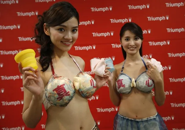 Models present lingerie maker Triumph's new concept bra, the “Omotenashi Compact Bra”, during its unveiling in Tokyo November 28, 2013. (Photo by Toru Hanai/Reuters)