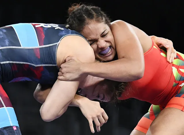 At right, Aline da Silva Ferreira of Brazil against Yasemin Adar of Turkey during their women's 76kg wrestling freestyle event at Makuhari Messe Hall A in Chiba, Japan on August 1, 2021. (Photo by Piroschka van de Wouw/Reuters)
