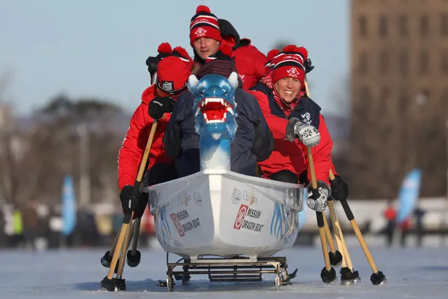 Participants compete during the Ice Dragon Boat Festival on Dows Lake in Ottawa, Ontario, Canada, February 9, 2019. (Photo by Chris Wattie/Reuters)