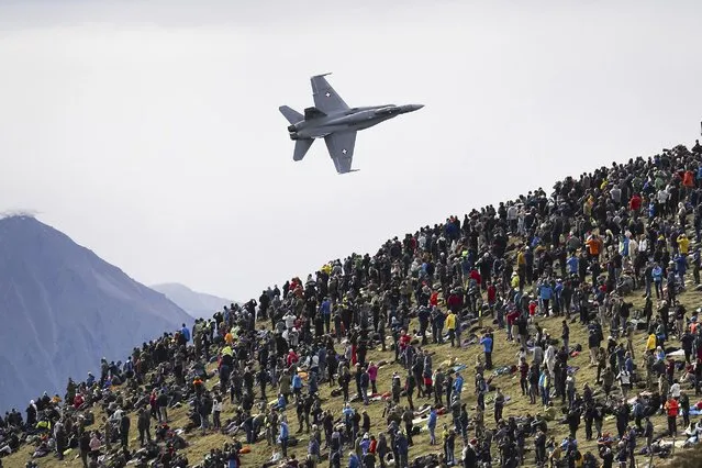 F/A-18 Hornet jet of the Swiss Air Force performs during the annual airshow of the Swiss Army in the Axalp area near Meiringen, Canton of Berne, Switzerland, Wednesday, October 18, 2023. (Photo by Anthony Anex/Keystone via AP Photo)