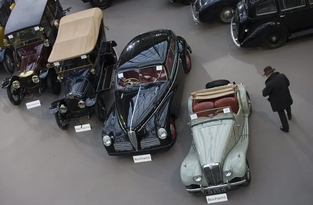 Classic cars and motorcycles are displayed during a press preview before a mass auction of vintage vehicles organised by Bonhams auction house as part of “Retromobile Week” at the Grand Palais in Paris, France, 05 February 2014. (Photo by Ian Langsdon/EPA)