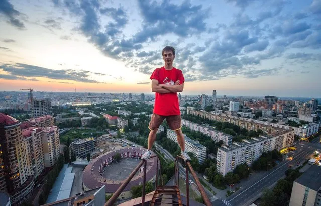 One of Yaroslav Segeda's friends on top of a tall building in Kiev. (Photo by Yaroslav Segeda/Solent News)