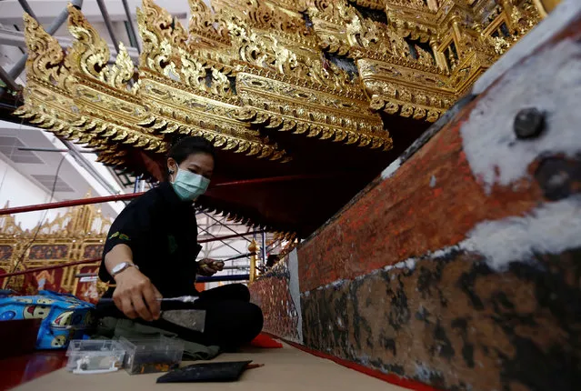 Thai officials from the Conservation Science Division of the Fine Arts Department of the National Museum of Thailand repairs the Royal Chariot, which will be used during the late King  Bhumibol Adulyadej's funeral later this year, Thailand, February 6, 2017. (Photo by Chaiwat Subprasom/Reuters)