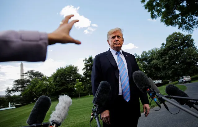 U.S. President Donald Trump talks to reporters as he departs for travel to Louisiana from the White House in Washington, U.S., May 14, 2019. (Photo by Carlos Barria/Reuters)