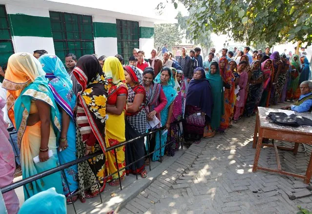Voters queue to cast their votes at a polling station during the fourth phase of the state assembly election in Allahabad, India, February 23, 2017. (Photo by Jitendra Prakash/Reuters)