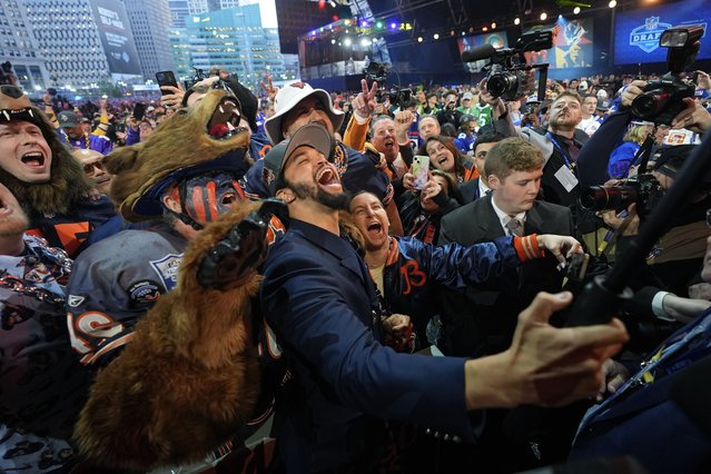 Southern California quarterback Caleb Williams celebrates after being chosen by the Chicago Bears with the first overall pick during the first round of the NFL football draft, Thursday, April 25, 2024, in Detroit. (Photo by Paul Sancya/AP Photo)