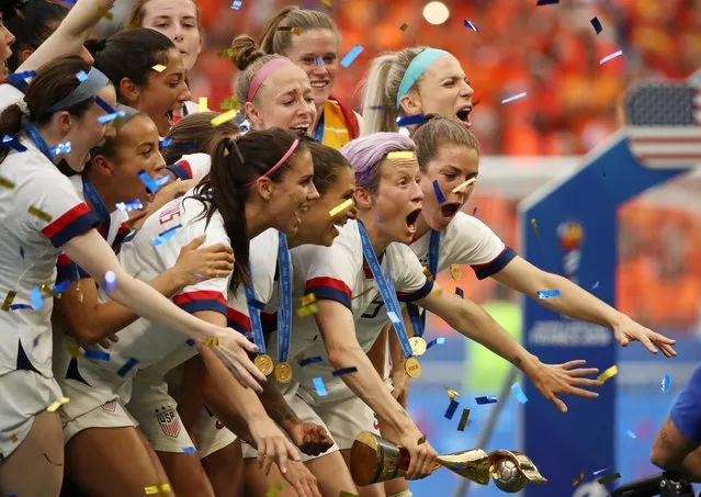 United States players celebrate their victory after the Women's World Cup final soccer match between US and The Netherlands at the Stade de Lyon in Decines, outside Lyon, France, Sunday, July 7, 2019. US won 2:0. (Photo by Denis Balibouse/Reuters)