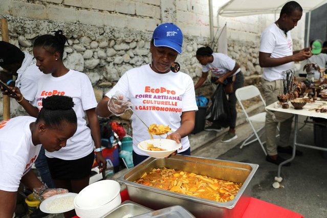 A woman prepares a serving of soup at a craft fair, in Port-au-Prince, Haiti on May 1, 2024. (Photo by Ralph Tedy Erol/Reuters)