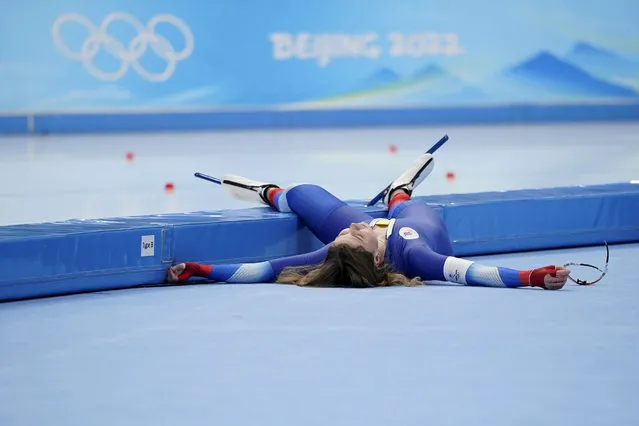 Olga Fatkulina of the Russian Olympic Committee flops onto the infield after finishing her heat in the women's speedskating 1,000-meter finals at the 2022 Winter Olympics, Thursday, February 17, 2022, in Beijing. (Photo by Ashley Landis/AP Photo)