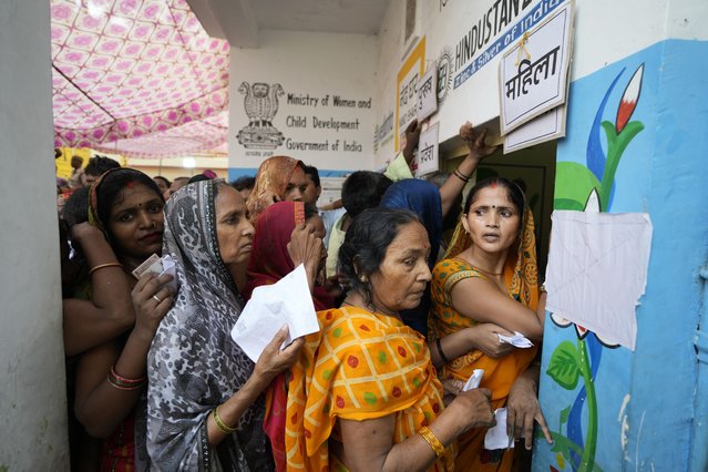 Women stand in queue to cast their votes in the seventh and final phase of national elections, in Varanasi, India, Saturday, June 1, 2024. Indians began voting Saturday in the last round of a six-week-long national election that is a referendum on Hindu nationalist Prime Minister Narendra Modi's decade in power. (Photo by Rajesh Kumar Singh/AP Photo)