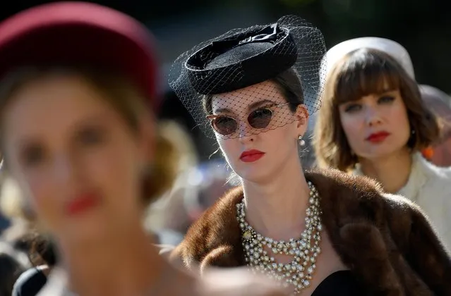 Motoring enthusiasts attend the Goodwood Revival, a three day classic car racing festival celebrating the mid-twentieth century heyday of the sport, at Goodwood in southern Britain, September 13, 2019. (Photo by Toby Melville/Reuters)